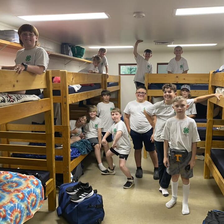 13 boy campers smiling in the cabin 